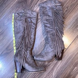Knee high fringe boots